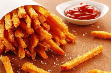 Freshly made sweet potato fries with catsup.
